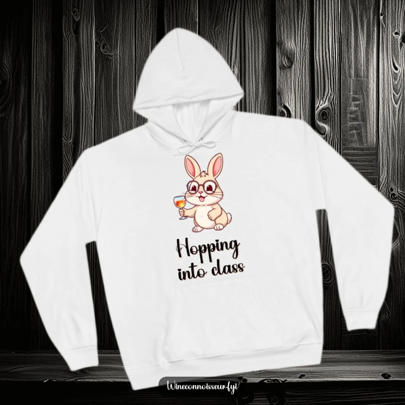 Funny hoodie showcasing a cheerful rabbit in a monocle, holding a tiny wine glass, blending comfort with sophisticated humor.